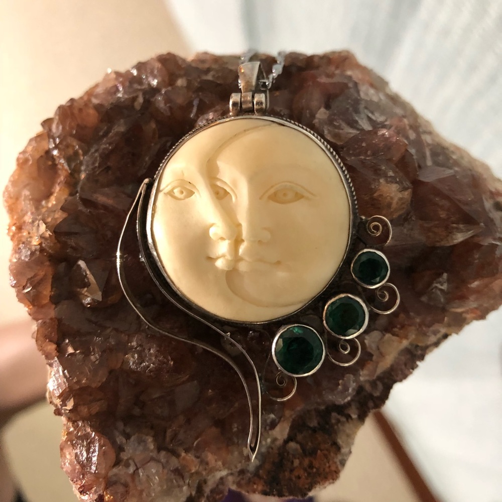 Stunning sun and moon pendant in sterling silver.